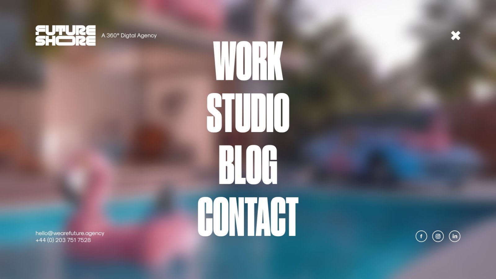 The Future Shore full-screen navigation overlay with Work, Studio, Blog and Contact in oversized white type over a blurred pool scene, the logo top left and contact details bottom left.